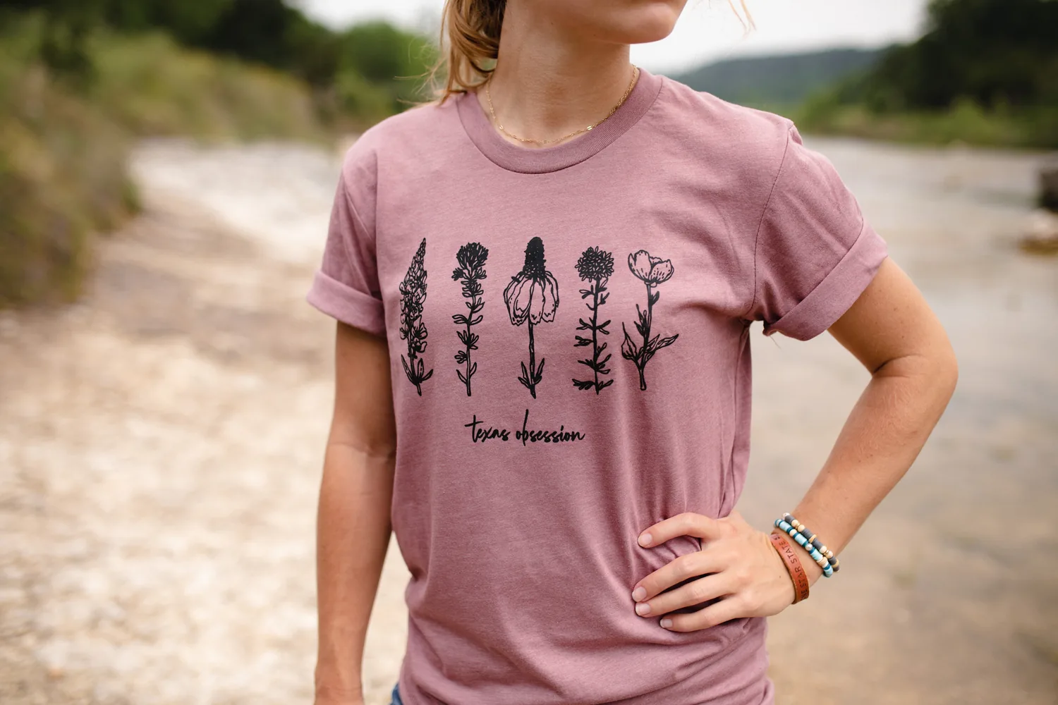 Model wearing Micah’s Texas Wildflowers tee outdoors