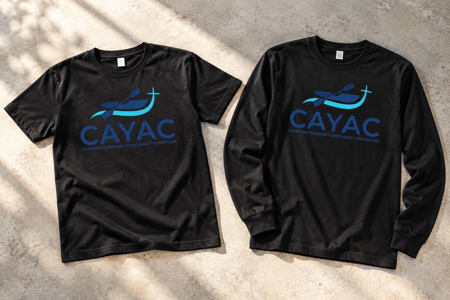 Staged CAYAC black T-shirt and long sleeve tee with supplied graphic